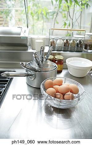 High angle view of a basket of eggs on the kitchen counter View Large Photo Image Stock Image - High angle view of a basket of eggs on the kitchen counter. Fotosearch