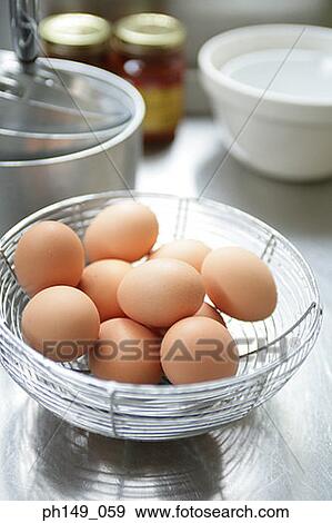 High angle view of a basket of eggs View Large Photo Image Stock Photo - High angle view of a basket of eggs. Fotosearch