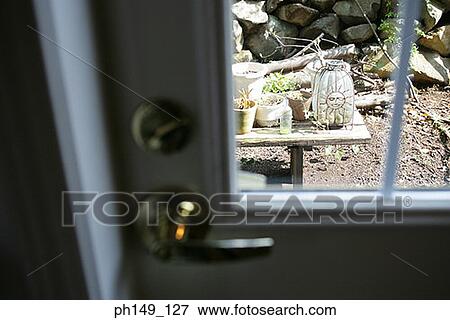 High angle view of potted plants viewed through a door View Large Photo Image Stock Photo - High angle view of potted plants viewed through a door. Fotosearch