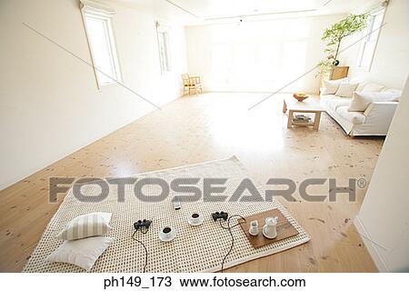 High angle view of tea cups and remote controls on a carpet View Large Photo Image Stock Image - High angle view of tea cups and remote controls on a carpet. Fotosearch