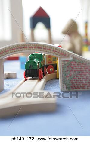 Model train passing under an overpass View Large Photo Image Stock Image - Model train passing under an overpass. Fotosearch