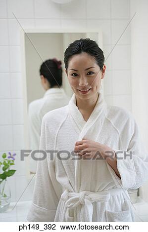 Portrait of a young woman smiling in the bathroom View Large Photo Image Stock Image - Portrait of a young woman smiling in the bathroom. Fotosearch