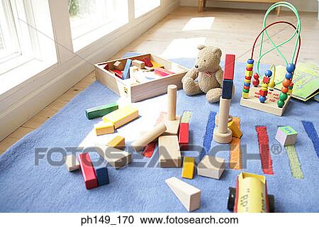 Toys and building blocks on a carpet View Large Photo Image Stock Image - Toys and building blocks on a carpet. Fotosearch