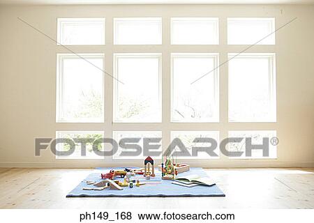 Toys and building blocks on a carpet View Large Photo Image Stock Photo - Toys and building blocks on a carpet. Fotosearch