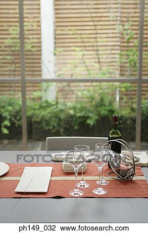 Wine bottle with wine glasses on the table View Large Photo Image Stock Image - Wine bottle with wine glasses on the table. Fotosearch