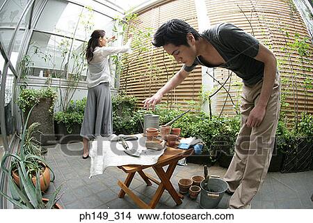 Young couple gardening View Large Photo Image Picture - Young couple gardening. Fotosearch