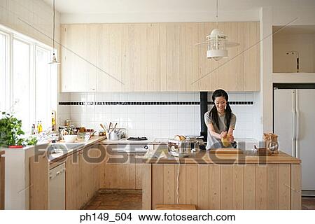 Young woman kneading pasta dough in the kitchen View Large Photo Image Picture - Young woman kneading pasta dough in the kitchen. Fotosearch