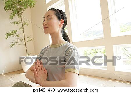 Young woman practicing yoga View Large Photo Image Stock Photo - Young woman practicing yoga. Fotosearch