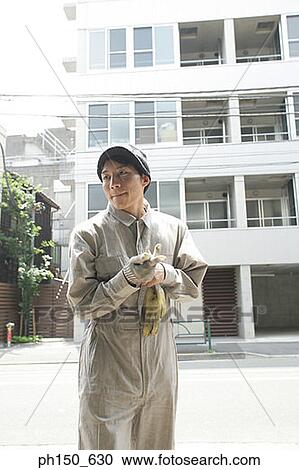 Auto mechanic wearing protective gloves View Large Photo Image Stock Image - Auto mechanic wearing protective gloves. Fotosearch