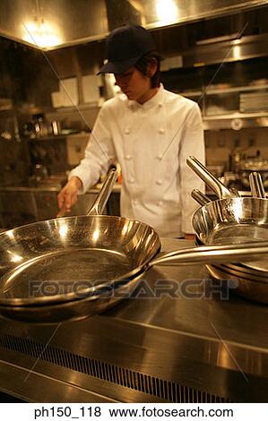 Chef preparing food in the kitchen View Large Photo Image Stock Photo - Chef preparing food in the kitchen. Fotosearch