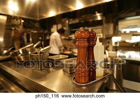 Stock Photograph - Chef preparing food in the kitchen. Fotosearch