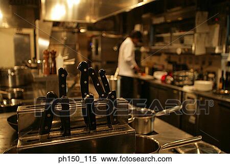 Chef preparing food in the kitchen View Large Photo Image Stock Photography - Chef preparing food in the kitchen. Fotosearch