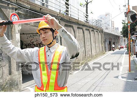 Close-up of a traffic cop holding a nightstick View Large Photo Image Stock Image - Close-up of a traffic cop holding a nightstick. Fotosearch