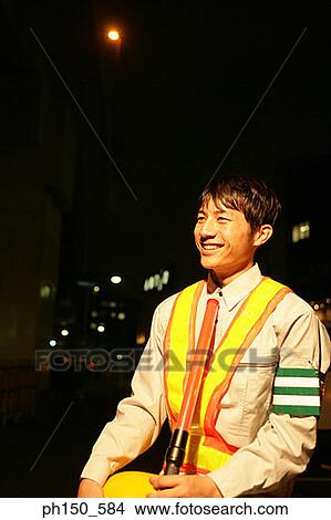 Picture - Close-up of a traffic cop smiling. Fotosearch