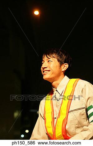 Close-up of a traffic cop smiling View Large Photo Image Stock Photograph - Close-up of a traffic cop smiling. Fotosearch