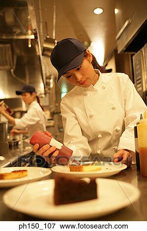 Close-up of a waitress dripping sauce on a piece of bread View Large Photo Image Stock Photo - Close-up of a waitress dripping sauce on a piece of bread. Fotosearch
