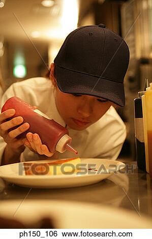 Close-up of a waitress dripping sauce on a piece of bread View Large Photo Image Stock Photograph - Close-up of a waitress dripping sauce on a piece of bread. Fotosearch
