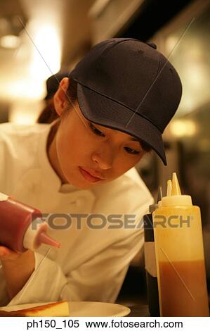 Close-up of a waitress dripping sauce on a piece of bread View Large Photo Image Stock Photography - Close-up of a waitress dripping sauce on a piece of bread. Fotosearch
