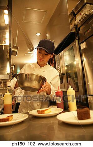 Close-up of a waitress holding a bowl View Large Photo Image Stock Image - Close-up of a waitress holding a bowl. Fotosearch