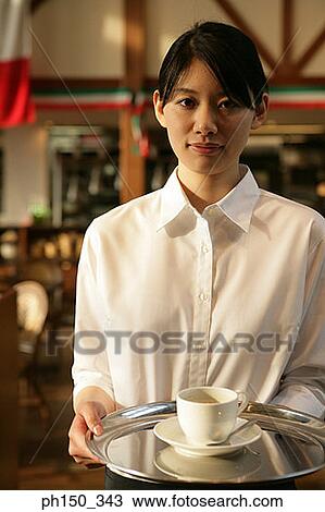 Close-up of a waitress holding a serving tray View Large Photo Image Stock Image - Close-up of a waitress holding a serving tray. Fotosearch