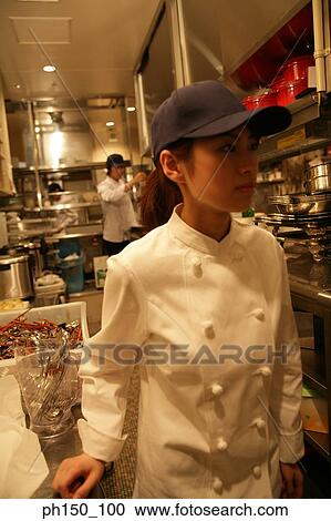 Close-up of a waitress standing in the kitchen View Large Photo Image Stock Image - Close-up of a waitress standing in the kitchen. Fotosearch