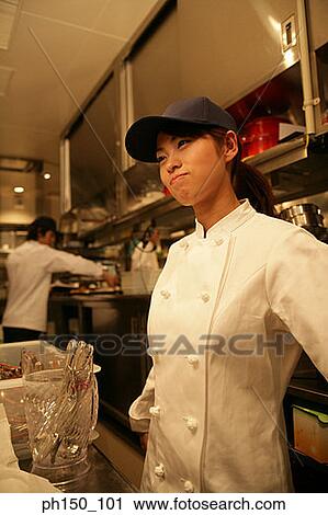 Close-up of a waitress standing in the kitchen View Large Photo Image Stock Image - Close-up of a waitress standing in the kitchen. Fotosearch
