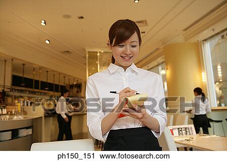 Close-up of a waitress taking an order View Large Photo Image Stock Image - Close-up of a waitress taking an order. Fotosearch