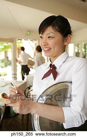 Close-up of a waitress taking an order View Large Photo Image Stock Photography - Close-up of a waitress taking an order. Fotosearch