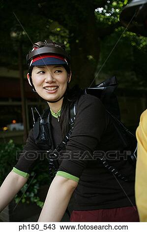 Stock Image - Close-up of a young woman smiling. Fotosearch