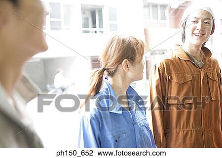 Close-up of three auto mechanics smiling View Large Photo Image Stock Image - Close-up of three auto mechanics smiling. Fotosearch