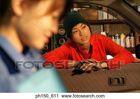 Close-up of two female auto mechanics in an auto repair shop View Large Photo Image Stock Image - Close-up of two female auto mechanics in an auto repair shop. Fotosearch