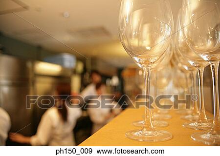 Close-up of wineglasses in a row View Large Photo Image Stock Photo - Close-up of wineglasses in a row. Fotosearch