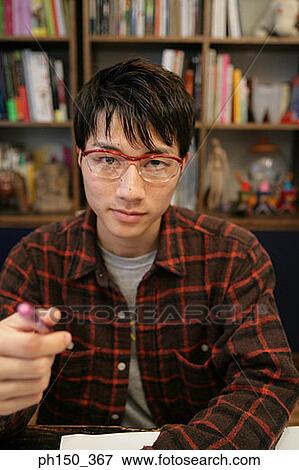 Stock Photo - Portrait of a businessman in an office. Fotosearch