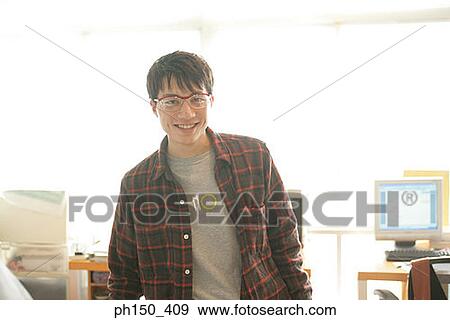 Stock Photo - Portrait of a businessman smiling. Fotosearch