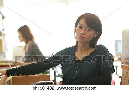 Portrait of a businesswoman smiling View Large Photo Image Stock Image - Portrait of a businesswoman smiling. Fotosearch
