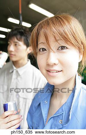 Portrait of a female auto mechanic holding a beer can View Large Photo Image Stock Photography - Portrait of a female auto mechanic holding a beer can. Fotosearch