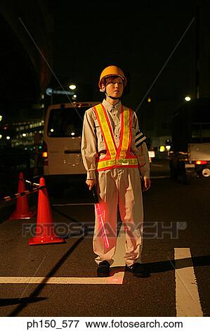 Portrait of a female traffic cop holding a nightstick View Large Photo Image Stock Photo - Portrait of a female traffic cop holding a nightstick. Fotosearch