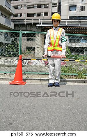 Portrait of a female traffic cop holding a nightstick View Large Photo Image Stock Photography - Portrait of a female traffic cop holding a nightstick. Fotosearch