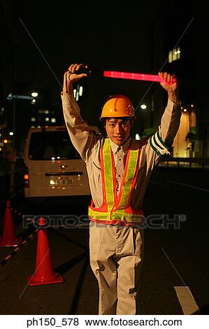 Portrait of a traffic cop holding up a nightstick View Large Photo Image Stock Photo - Portrait of a traffic cop holding up a nightstick. Fotosearch