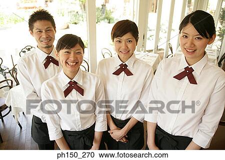 Portrait of a waiter and three waitresses smiling View Large Photo Image Stock Image - Portrait of a waiter and three waitresses smiling. Fotosearch