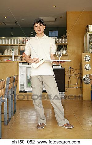 Portrait of a waiter holding a tray with a glass of water and a notepad View Large Photo Image Stock Image - Portrait of a waiter holding a tray with a glass of water and a notepad. Fotosearch