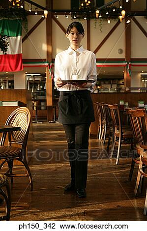 Portrait of a waitress holding a serving tray View Large Photo Image Stock Image - Portrait of a waitress holding a serving tray. Fotosearch