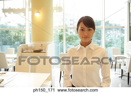 Portrait of a waitress in a restaurant View Large Photo Image Stock Image - Portrait of a waitress in a restaurant. Fotosearch