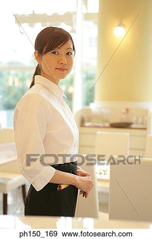Portrait of a waitress in a restaurant View Large Photo Image Stock Photo - Portrait of a waitress in a restaurant. Fotosearch