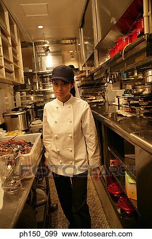 Portrait of a waitress standing in the kitchen View Large Photo Image Stock Photo - Portrait of a waitress standing in the kitchen. Fotosearch