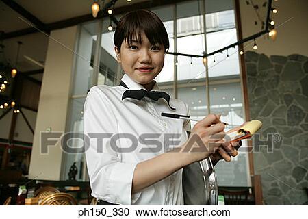 Portrait of a waitress taking an order in a restaurant View Large Photo Image Stock Image - Portrait of a waitress taking an order in a restaurant. Fotosearch