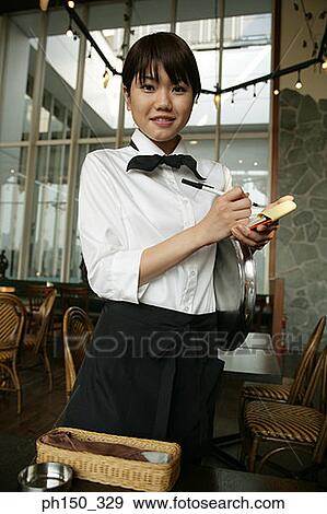 Portrait of a waitress taking an order in a restaurant View Large Photo Image Stock Photo - Portrait of a waitress taking an order in a restaurant. Fotosearch