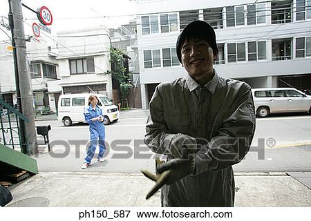 Portrait of an auto mechanic smiling View Large Photo Image Stock Photo - Portrait of an auto mechanic smiling. Fotosearch
