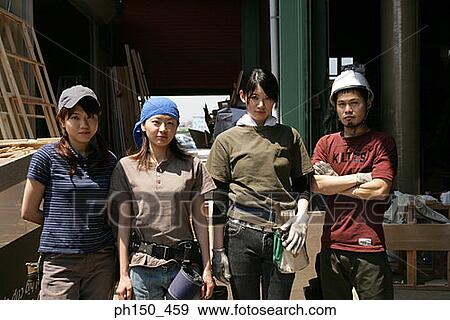 Portrait of four carpenters standing side by side View Large Photo Image Stock Photo - Portrait of four carpenters standing side by side. Fotosearch