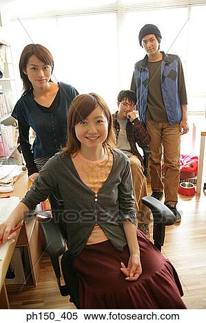 Portrait of two businesswomen and two businessmen in an office View Large Photo Image Stock Photography - Portrait of two businesswomen and two businessmen in an office. Fotosearch